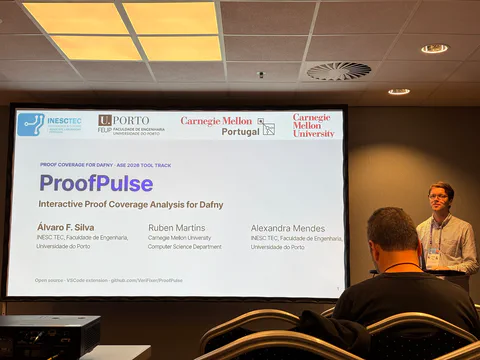 Álvaro presenting the ProofPulse title slide at ASE.
