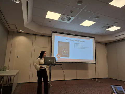 Isabel discussing failing verification during the DafnyFix presentation.