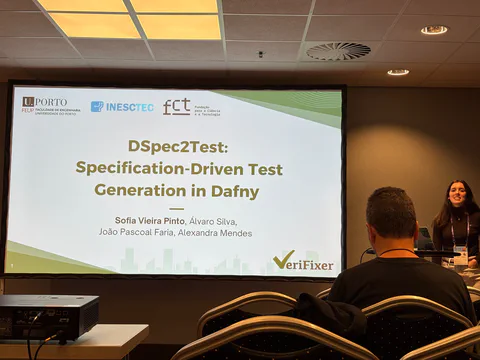Sofia presenting the DSpec2Test title slide at ASE.